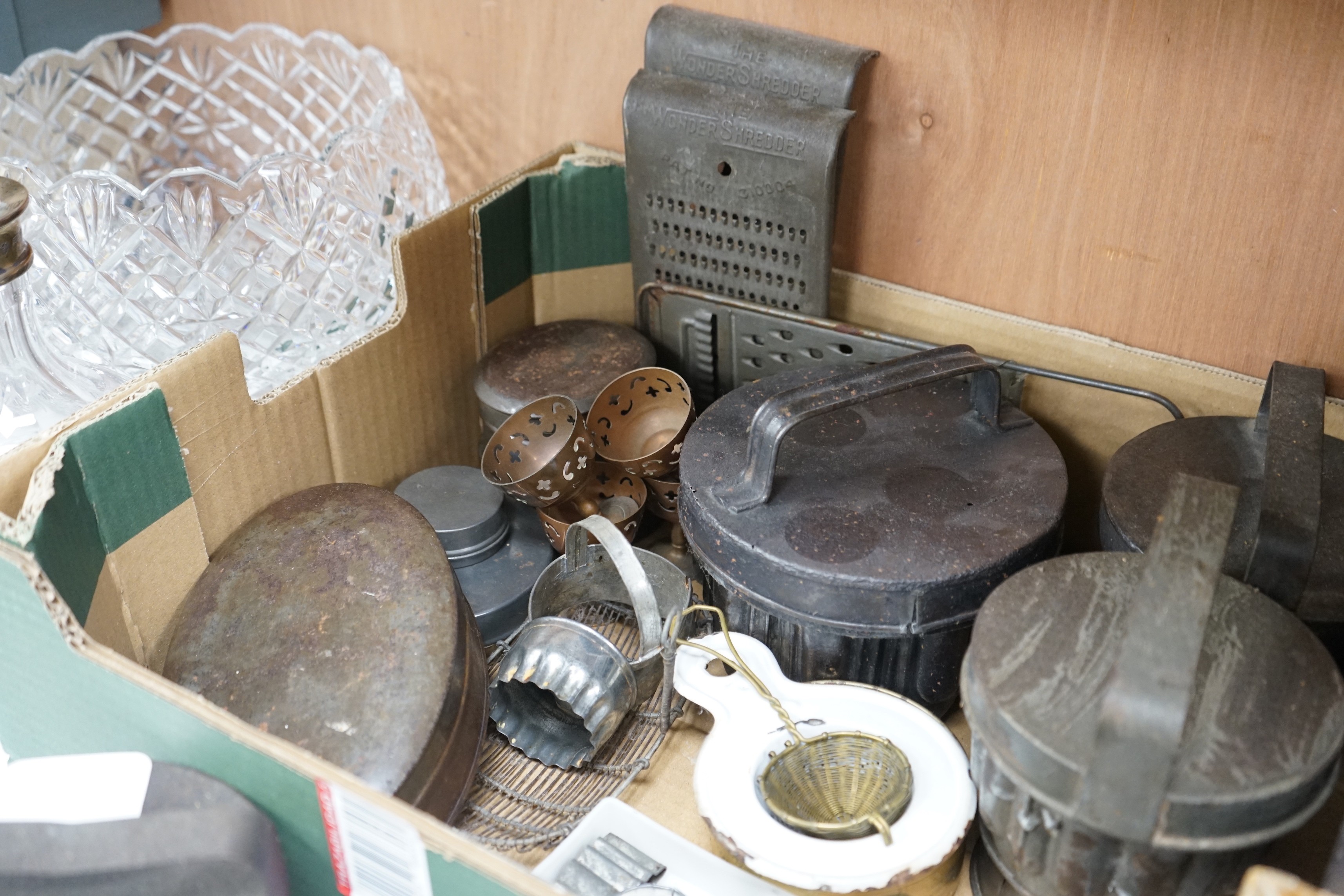 A good collection of tin plated iron jelly moulds, pastry moulds and kitchenalia